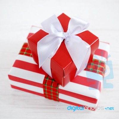 Red Gift Box With White Ribbons Stock Photo