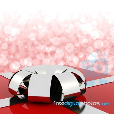 Red Giftbox With Bokeh Backdrop Stock Image