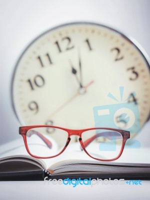 Red Glasses On The Book Stock Photo