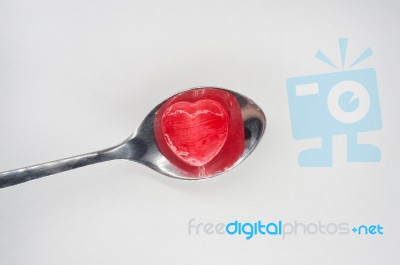 Red Heart Candy On Spoon For Valentine's Day Stock Photo