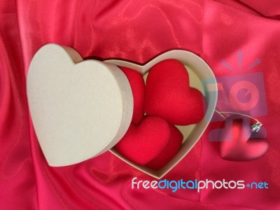 Red Heart On Red Fabric For Valentines Day Stock Photo