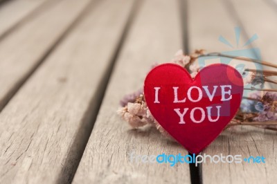 Red Heart With Space On Wooden Floor Stock Photo