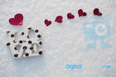 Red Hearts And Love On Snow Stock Photo