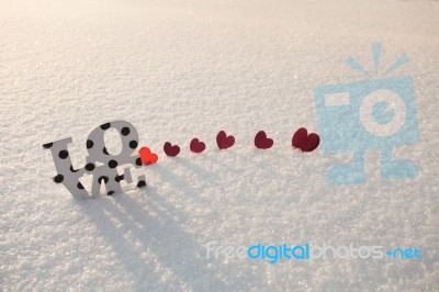 Red Hearts And Love On Snow Stock Photo