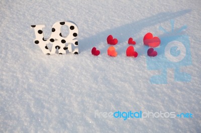 Red Hearts And Love On Snow Stock Photo