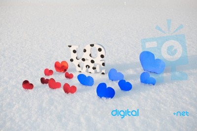 Red Hearts And Love On Snow Stock Photo