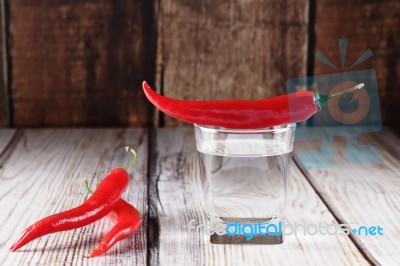 Red Hot Chili Peppers With Glass Of Water Stock Photo