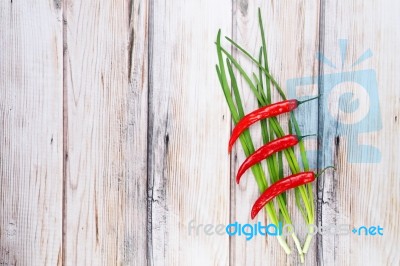 Red Hot Chilli Pepper And Scallions Stock Photo