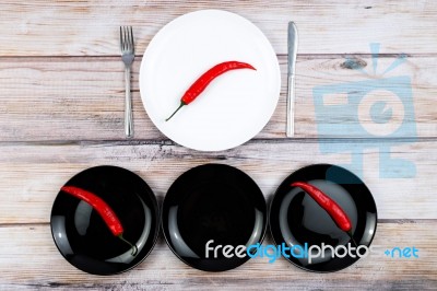 Red Hot Chilli Peppers On Plate Stock Photo