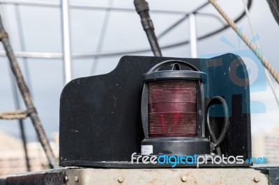 Red Lamp On An Old Yacht Moored In Los Christianos Harbour Tener… Stock Photo