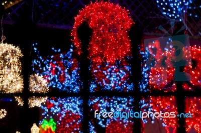 Red Light Ball Behind Iron Railings Stock Photo