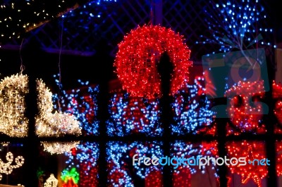 Red Light Ball Behind Iron Railings Stock Photo