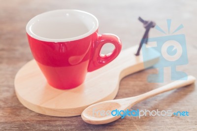 Red Mug With Wooden Plate Stock Photo