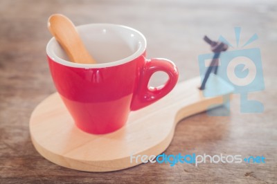 Red Mug With Wooden Plate Stock Photo