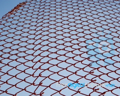 Red Net Fence Textures With Sky Background Stock Photo