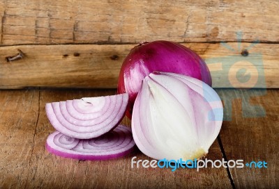 Red Onion On The Wooden Background Stock Photo