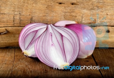 Red Onion On The Wooden Background Stock Photo