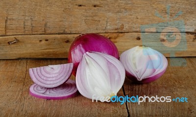 Red Onion On The Wooden Background Stock Photo