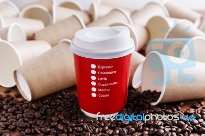 Red Paper Coffee Cup With Paper Cups Background Stock Photo