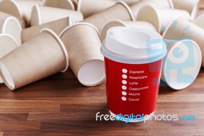 Red Paper Coffee Cup With Paper Cups Background Stock Photo