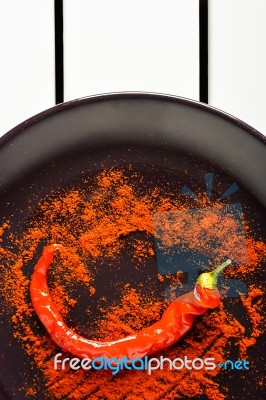 Red Pepper With Ground Paprika Stock Photo