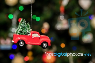 Red Pickup Car With Christmas Tree Hanging On Christmas Tree Stock Photo