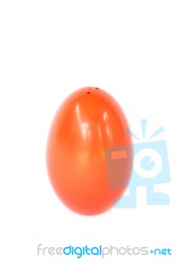 Red Plastic Egg On White Background Stock Photo