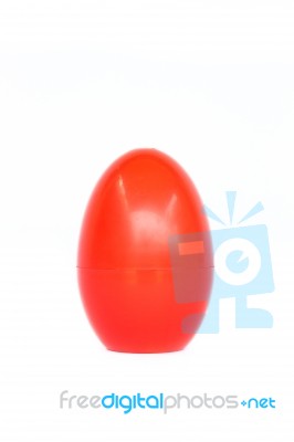 Red Plastic Egg On White Background Stock Photo