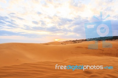 Red Sand Dune And Sunset Stock Photo