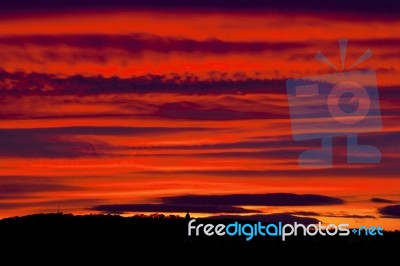 Red Sunset Sky With Clouds Stock Photo