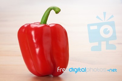 Red Sweet Pepper On Table Stock Photo