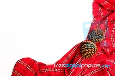 Red Table Cloth With Pine Cone And Copy Space Stock Photo