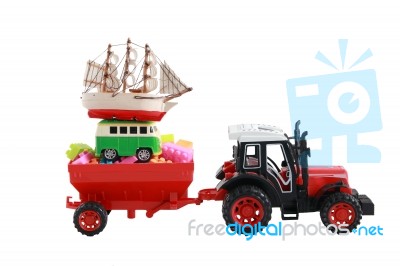 Red Tractor Toy Carry Small Car And Boat Isolated On White Backg… Stock Photo