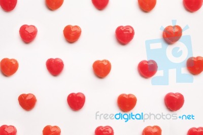 Red Valentine's Day Heart Shape Candy Pattern On Empty White Paper Background. Love Concept. Colorful Hipster Style. Knolling Top View Stock Photo