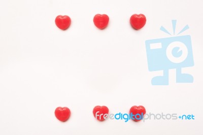 Red Valentine's Day Heart Shape Candy Pattern On Empty White Paper Background. Love Concept. Colorful Hipster Style. Knolling Top View Stock Photo