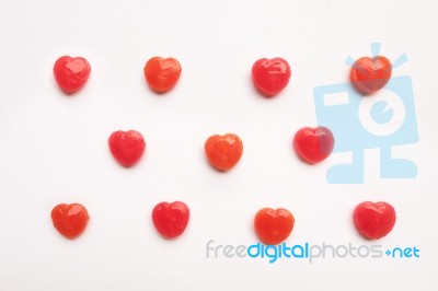 Red Valentine's Day Heart Shape Candy Pattern On Empty White Paper Background. Love Concept. Colorful Hipster Style. Knolling Top View Stock Photo