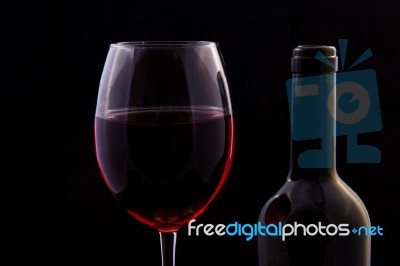 Red Vine In Glass And Open Bottle Stock Photo