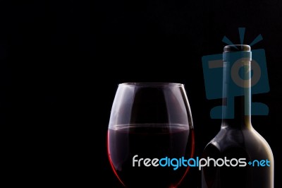 Red Vine In Glass And Open Bottle Stock Photo