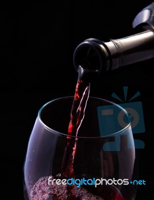 Red Vine Pouring From Bottle Stock Photo