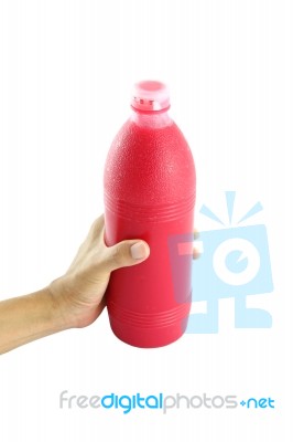 Red Water Bottle In Hand On White Background Stock Photo