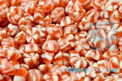 Red White Creme Swirled Hard Candy Snack Group. Strawberry And Vanilla Sweets Background Stock Photo