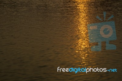 Reflex Of Sunset In Water Stock Photo