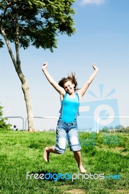 Rejoicing Young Girl Stock Photo