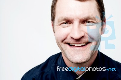 Relaxed Middle Aged Man Posing Stock Photo