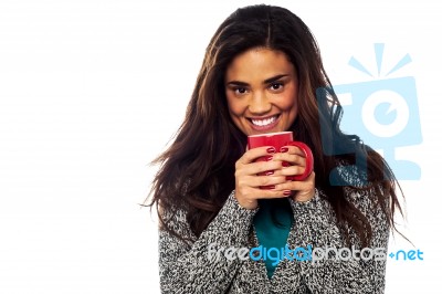 Relaxed Mixed Race Woman Having Coffee Stock Photo