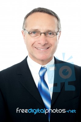 Relaxed Pose Of Aged Businessman Stock Photo