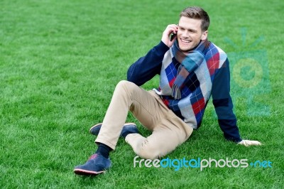 Relaxed Young Fashion Guy On Call Stock Photo