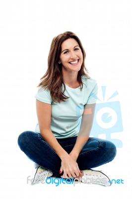 Relaxing Woman Sitting On Floor Stock Photo