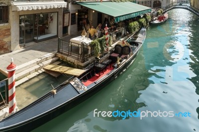 Restaurant Alongside A Canal In Venice Stock Photo