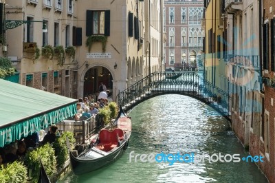 Restaurant Alongside A Canal In Venice Stock Photo